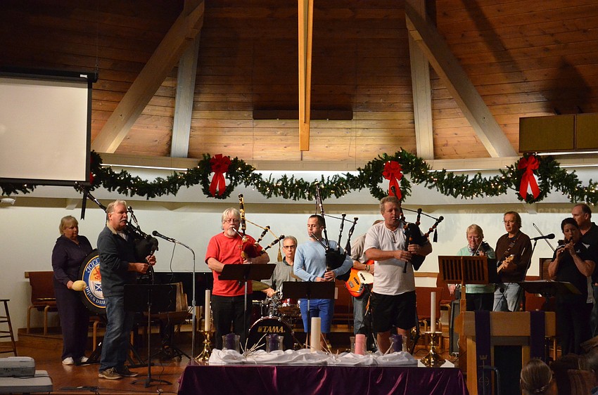 Pipers Kevin Oâ€™Neil, Larry Jacobs, Ross Allen and Gary Reinstrom blow into their bagpipes