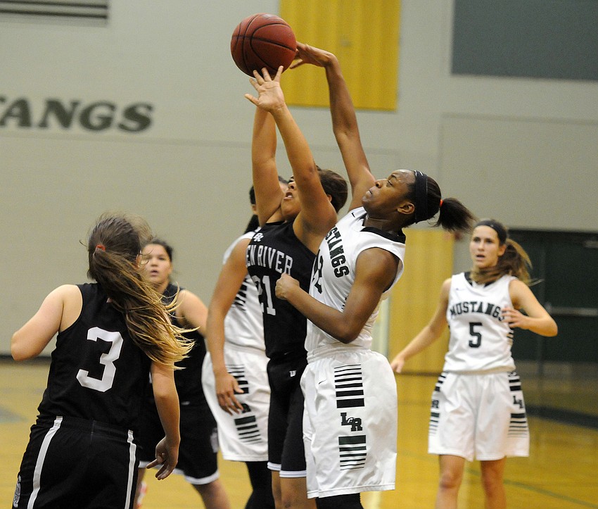 Lakewood Ranch sophomore Aleah Robinson blocks Braden Riverâ€™s Kwinci Goochâ€™s shot.