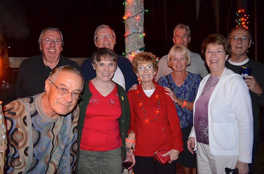 Friends gather to watch boats parade down Braden River.