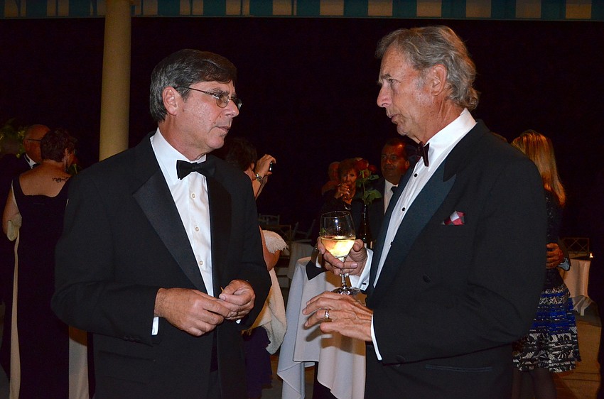 Michael Levitan and David Krombeen make some talk.