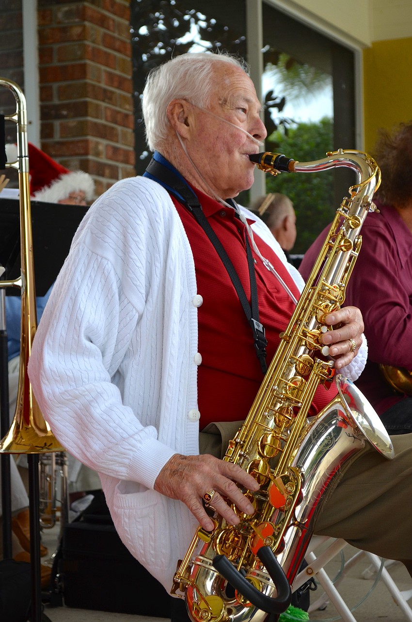 Dick Smalley plays the saxophone during the band's rendition of 