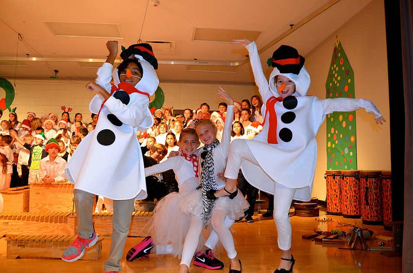 The snow people joke around after their performance.