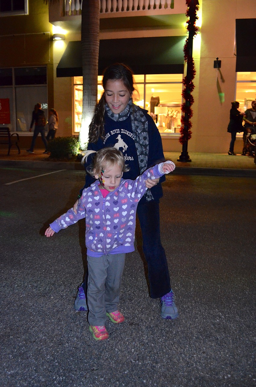 Jada and Kara Young dance to Christmas music.