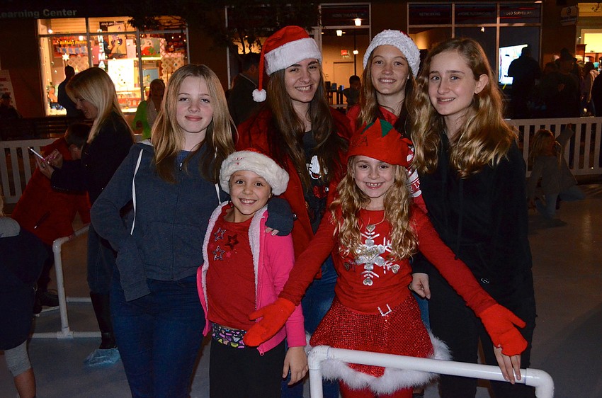 Friends Lydia Hart, Marissa Boccarossa, Basia Kuehn, Amanda and Jessica Boccarossa and Ali Inverso test out the skating rink.