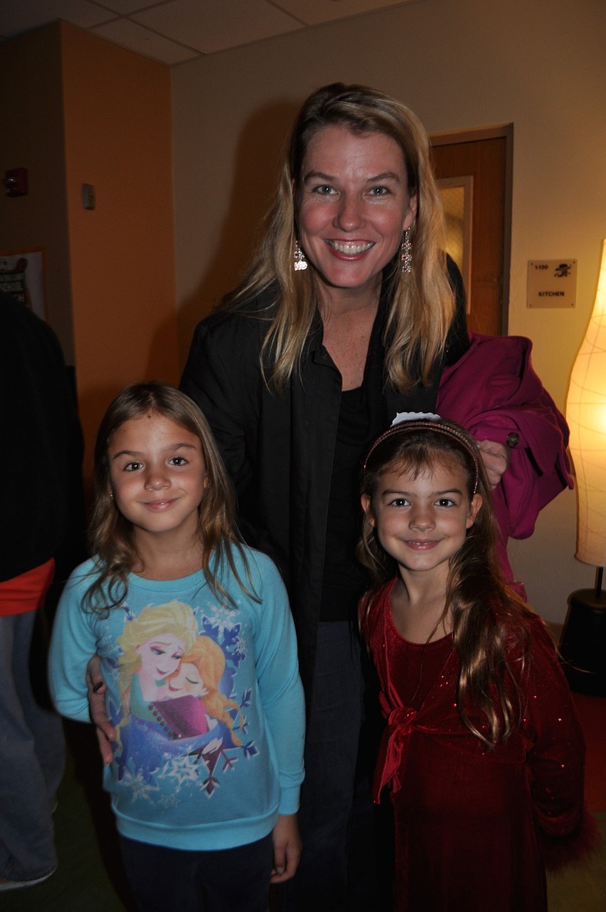 Tina, Barbara and Jackie Collazo are eager to see Santa.