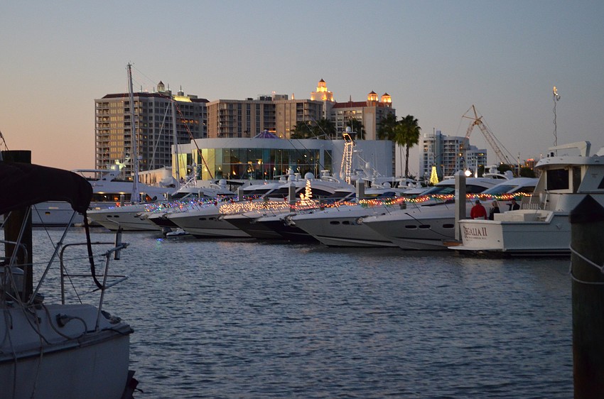 Boats docked at Marina Jack were decorated with lights.