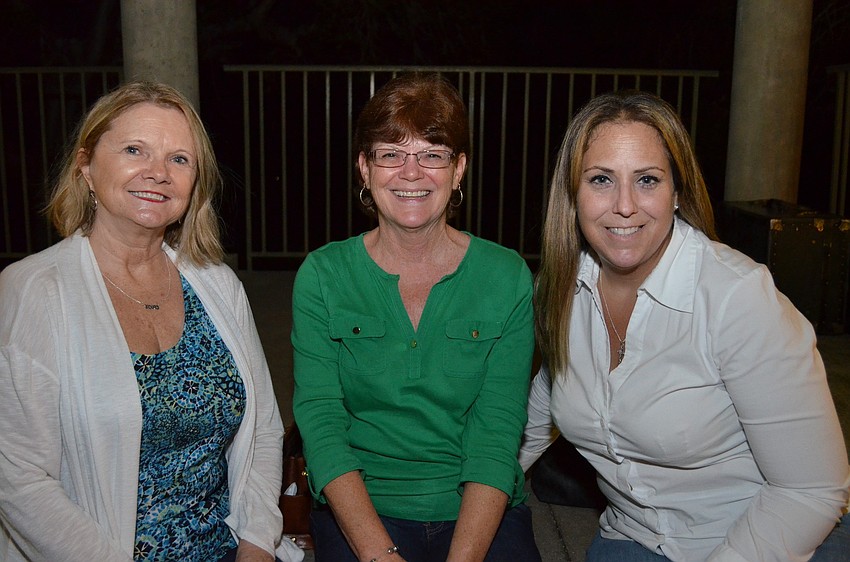 Linda Berken, Diane Upton and Francie Pages enjoy the lights at Historic Spanish Point.