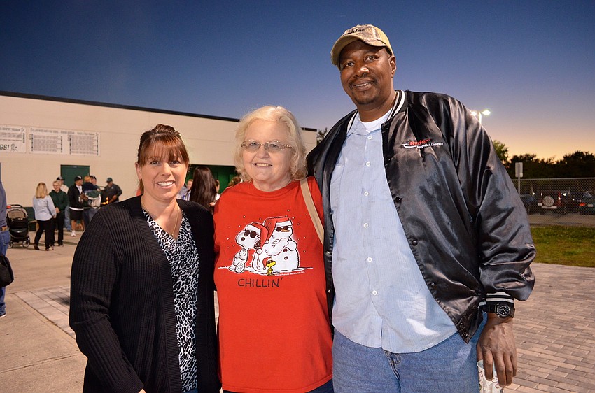 Nicole Squitieri, Tina Morris and Derek Faison cheer for the lady mustangs.