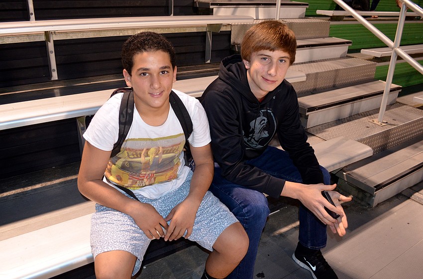 Meher Chtay and Dustin Shaw show support for the ladies competing in the game.