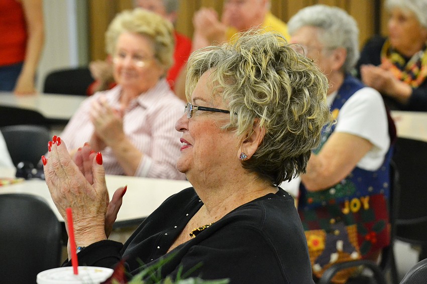 Jane Barnett claps to the music at the performance at Jefferson Center.