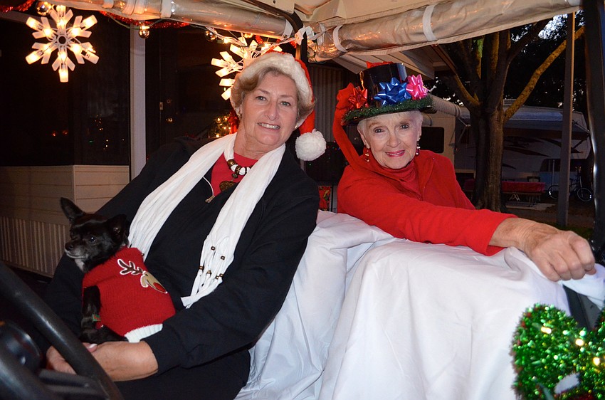 Sassy cozies up with Judy Lamberth and Elaine Miller before the parade starts.