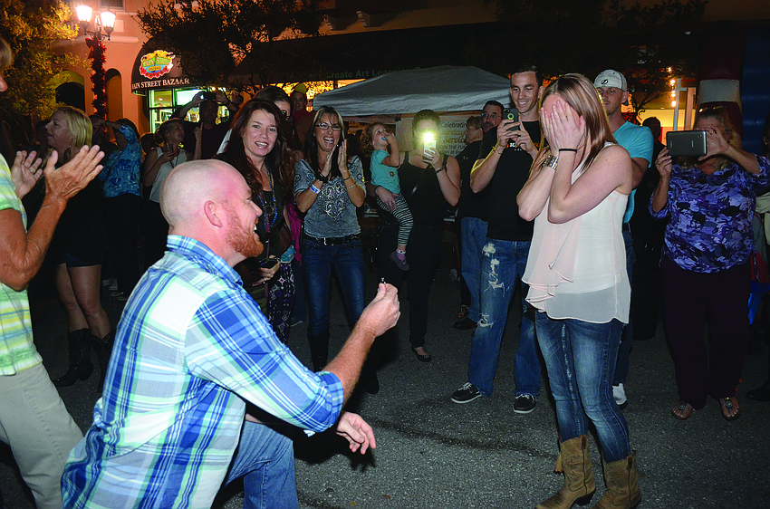Mary Cantrell, right, smiles as her campaign volunteers announce she has taken the lead in the school board election race. Nolan Middle School teacher Margi Nanney cheers from behind.
