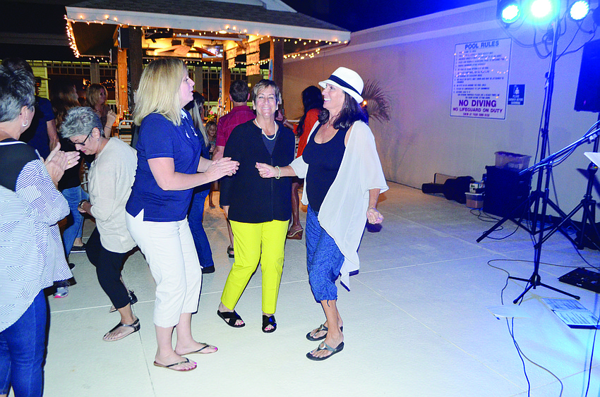 Lorraine Lancaster, Cathy Landis and Penny Klein dance to music performed by Blues Pig Band during the Longboat Key Historical Society's Fish Fry Nov. 7, at Cedars Tennis Resort.