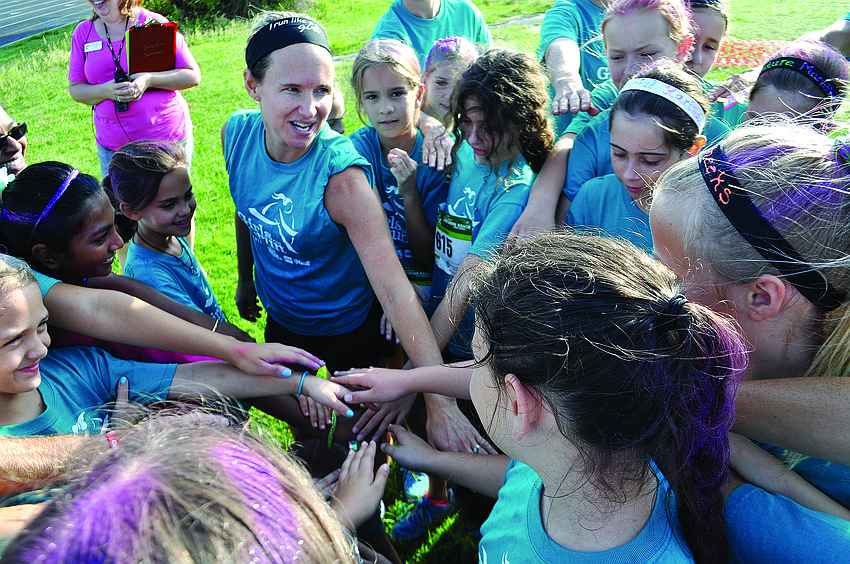 Girls Inc. participants shout a cheer before the Run for the Music 5K at Lakewood Ranch High School.