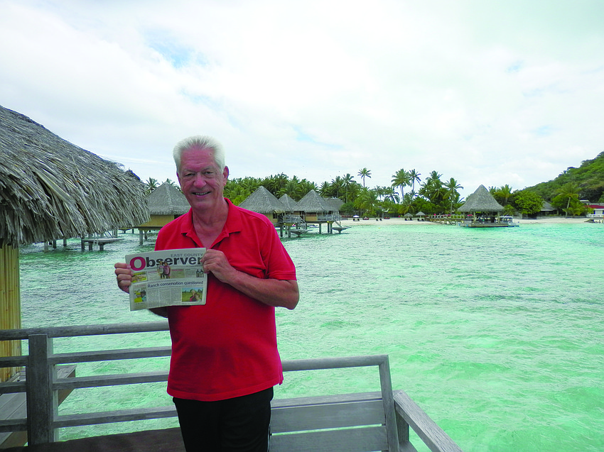 POLYNESIAN RELAXATION. David Johnson brought his East County Observer along on a recent trip to Bora Bora, French Polynesia.