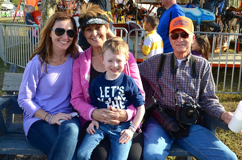 Kelly Powell, Gina and Gene Page, and Paxton Powell enjoy family time.