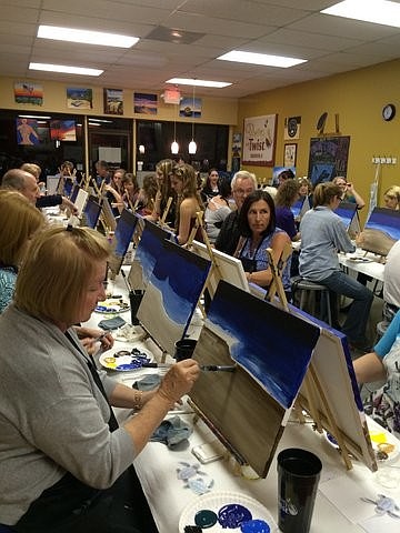 Longboat Key Turtle Watch. Longboat Key Turtle Watch held an event Jan. 14, at Painting with a Twist in Bradenton. Attendees painted scenes of a turtle moving toward the ocean at night. The club raised $600 from the event. Photos by Cyndi Seamon