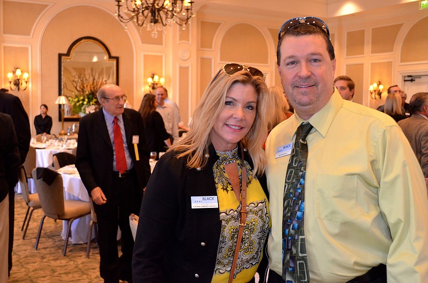 Joanna Ginder-Ashley and Nick DeVito find a seat in the crowded room.