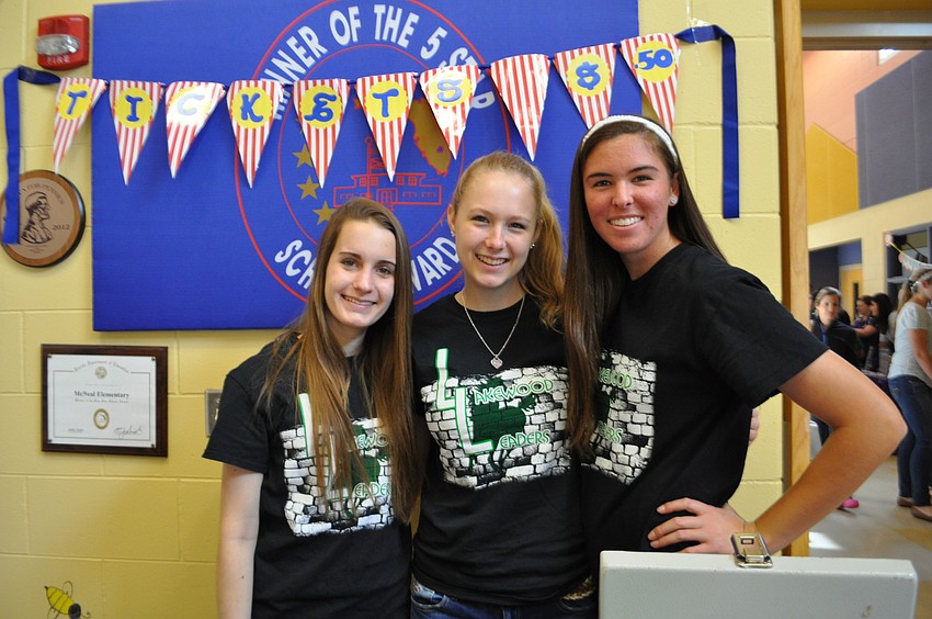 Sarah O'Neil, Kaleigh Gardiner and Kylie Ernst, of Lakewood Leaders, sell tickets.