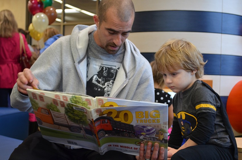 Zachary and Gabriel Hawk waste no time in the new Gulf Gate Library reading â€œ20 Big Trucks.â€
