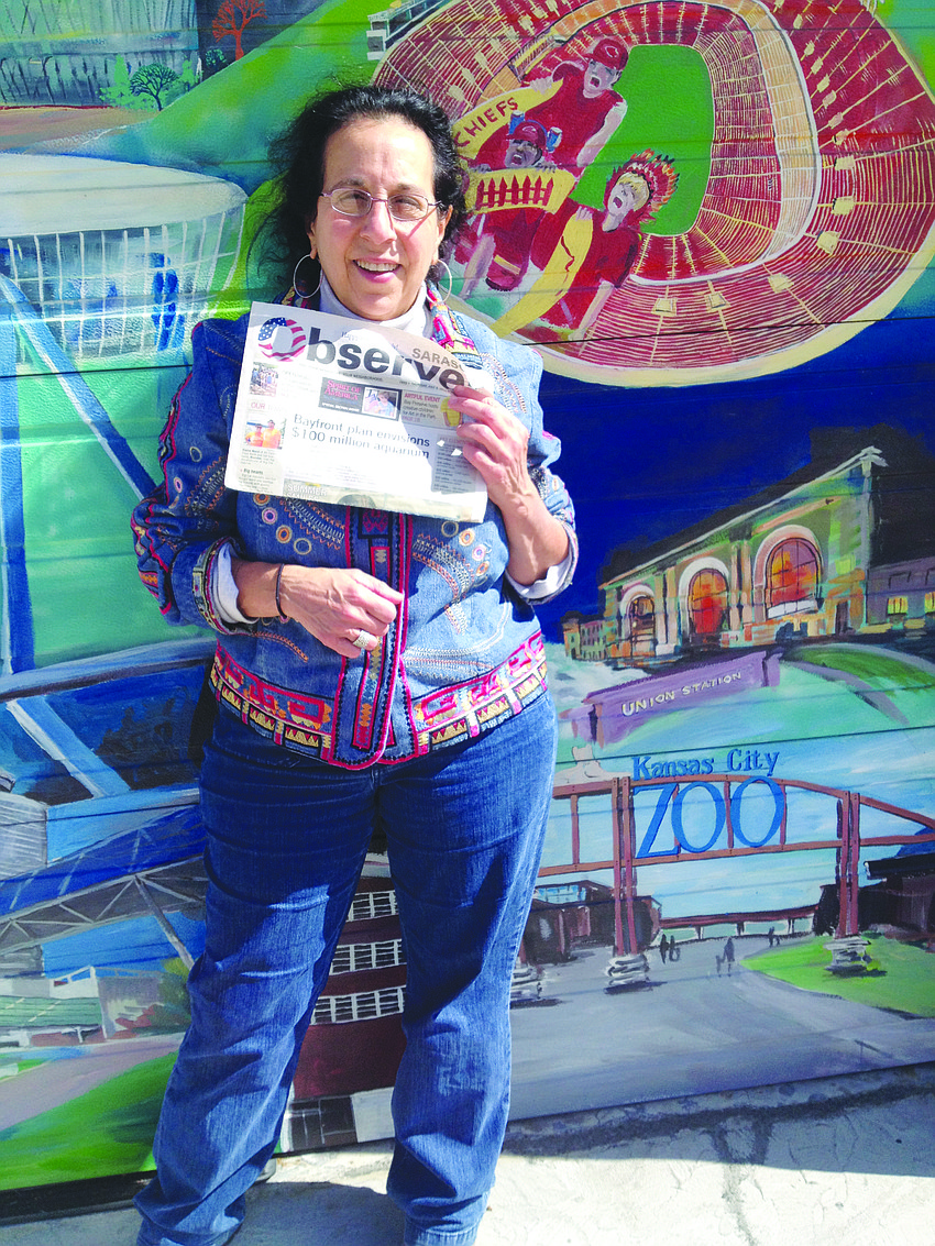 WEDDING BELLE. Robin Potter attended a family wedding in Kansas City, Mo., and caught up on her Sarasota Observer news while on the trip.