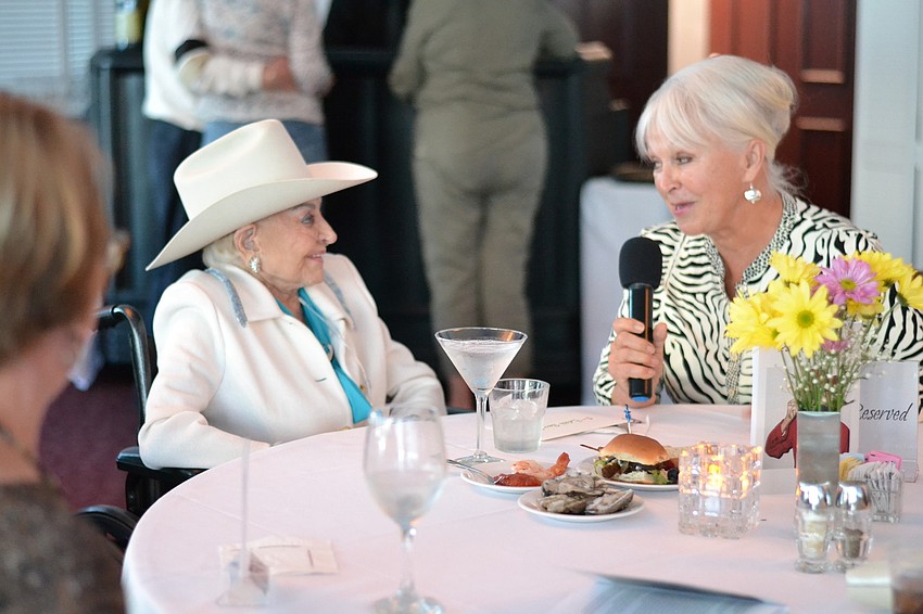 Sylvia Babineau shares a moment with guests and Edith Barr Dunn.