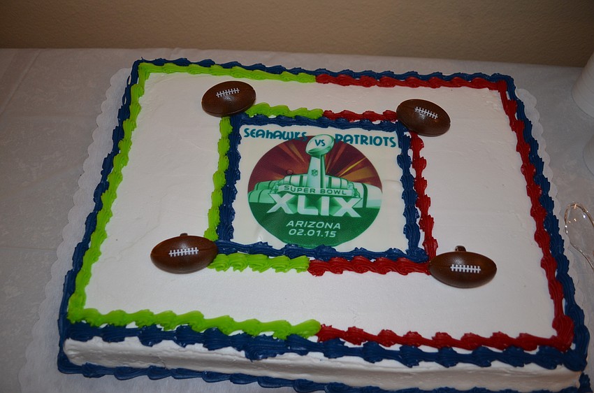 Residents ate a cake honoring both teams of the Super Bowl.