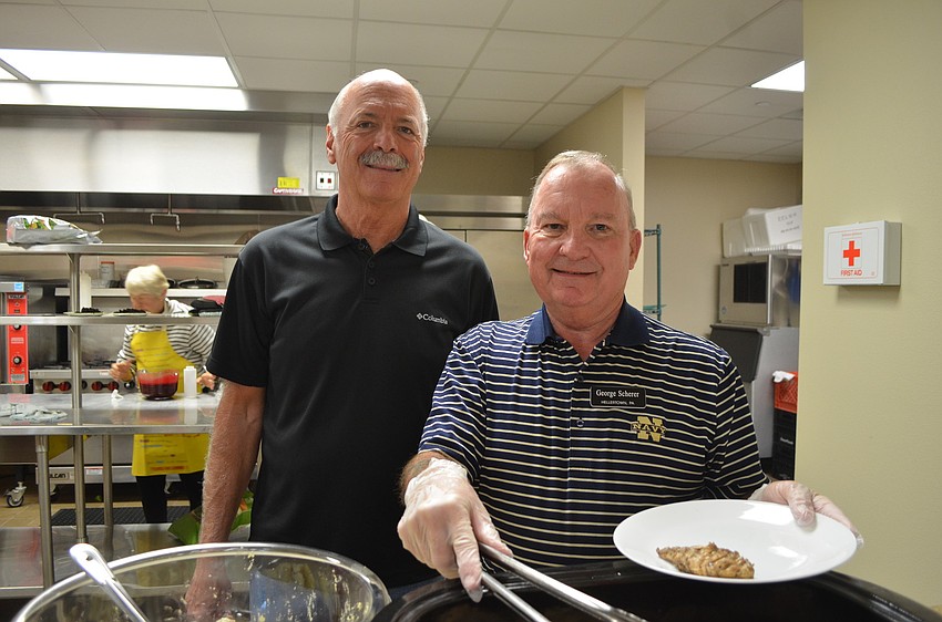 Bob Dods, who cooked the meal, with George Scherer