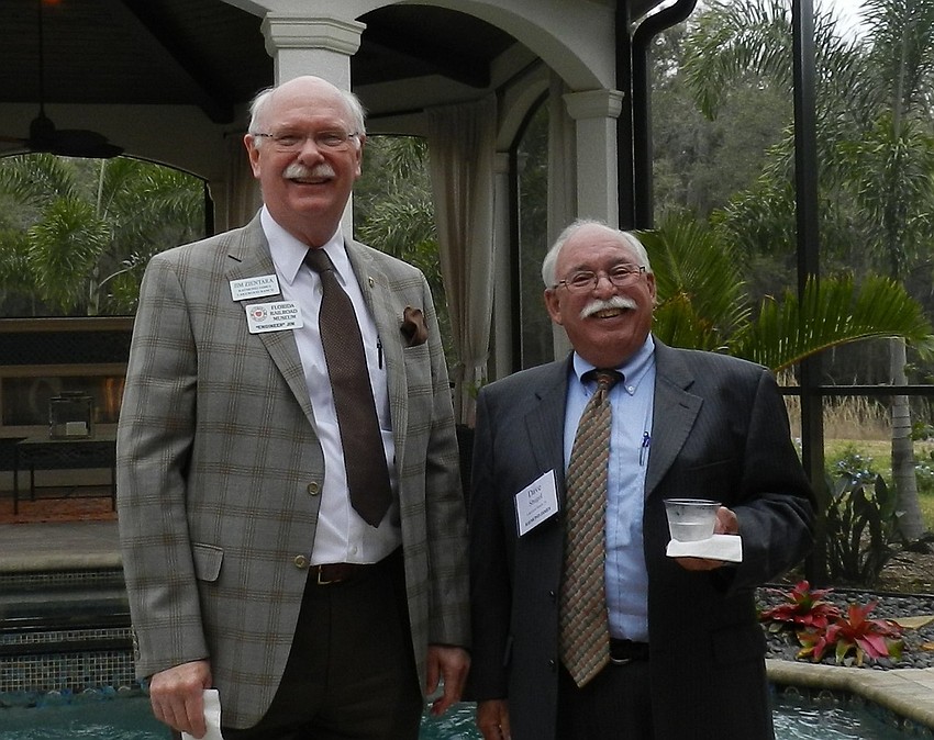Jim Zientara and Dave Shugol of Raymond James Financial Services enjoy a night out.