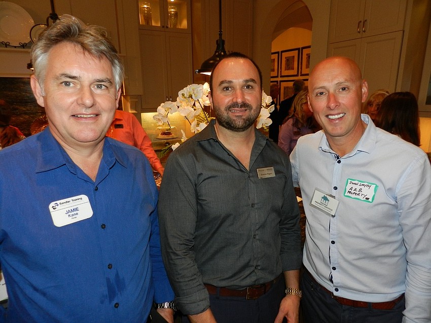 Jamie Kane, Shannon Rogers and John Smyth enjoy the social setting.
