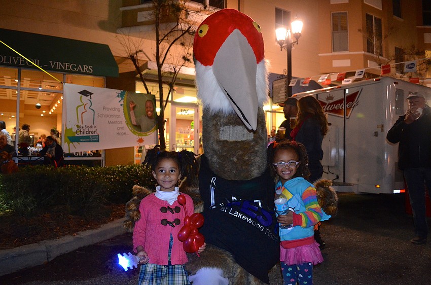 Cranky stops for a photo opp. with his two new friends, Shadai and Siloam Magra.