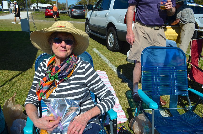 Pam Kean relaxes in the sun during the match.