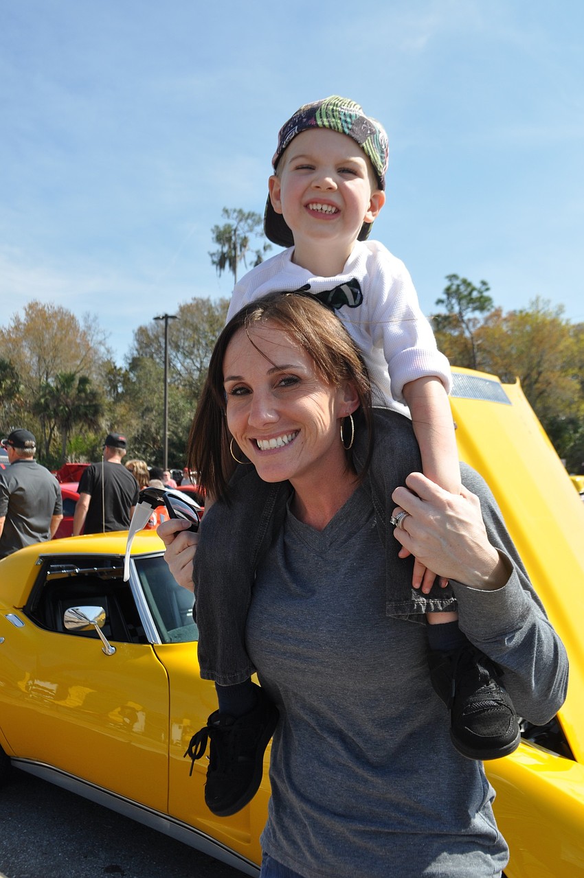 Brandie Havell gives her son, Van, a lift.