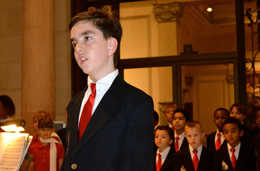 Alongside his Pine View School classmates, Luke Wansa performs patriotic songs for a crowd.
