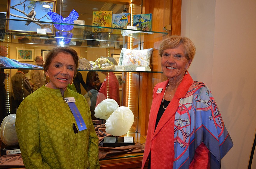 Exhibitor Joan Partridge and Art Committee Chairperson Marilyn Huseby in front of Partridgeâ€™s alabaster sculpture