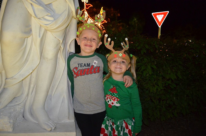Zach Woodside, 6, dons reindeer antlers with sister, Kate, 3.