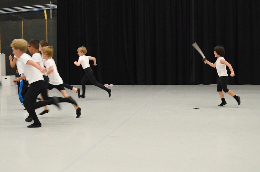 Youngest lost boy Adam Attari chases the lost boys with his sword in one scene of the â€œPeter Panâ€ ballet