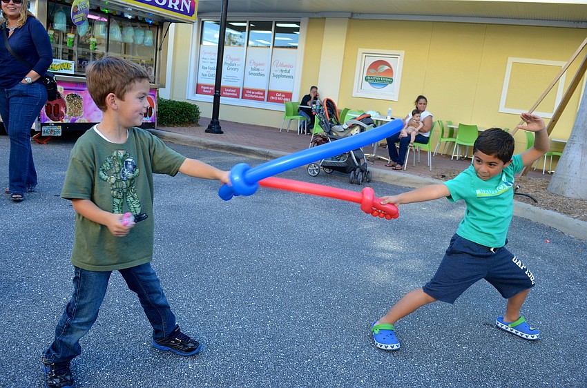 Jacob Lies and Lucas Soto engage in a sword fight.