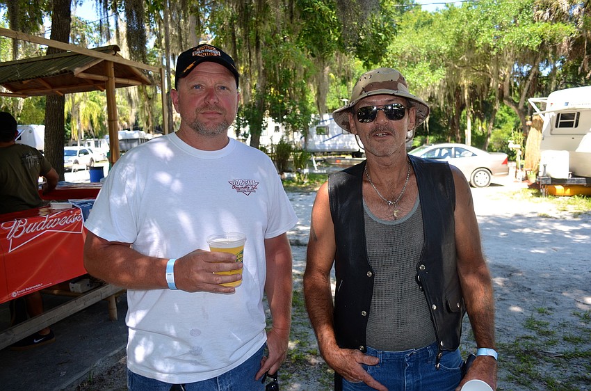 Heath Davis and Lynn Privitt enjoy food and drinks.