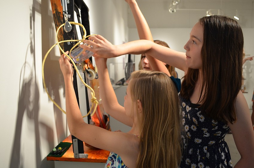 The Out-of-Door Academy students Chelsea Ball and Dylan Black with the interactive piece they built, 