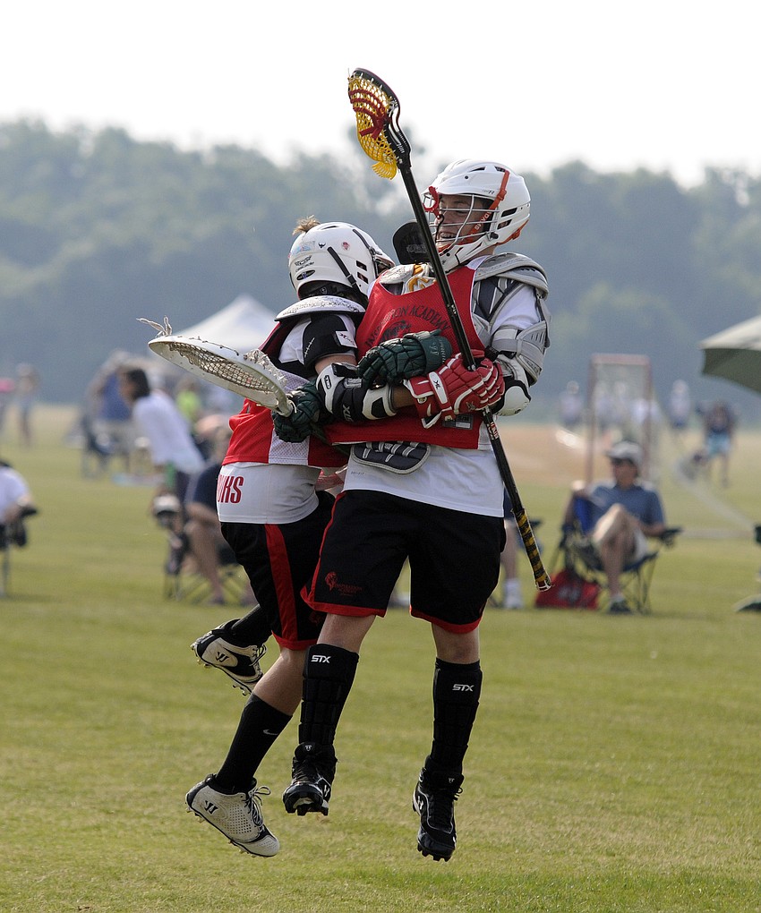 Inspiration Academyâ€™s Gavin Feaster and Ryan Medinis congratulate one another following their game versus Monsters Lacrosse Academy May 24.