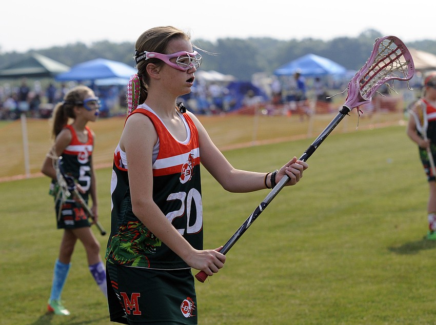 Twelve-year-old Elise Dean awaits a pass from a teammate during the Monstersâ€™ warmup drills.
