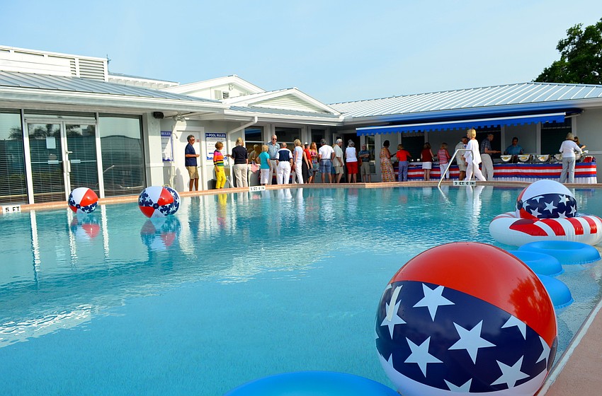 Patriotic decorations kept with the spirit of the poolside picnic.