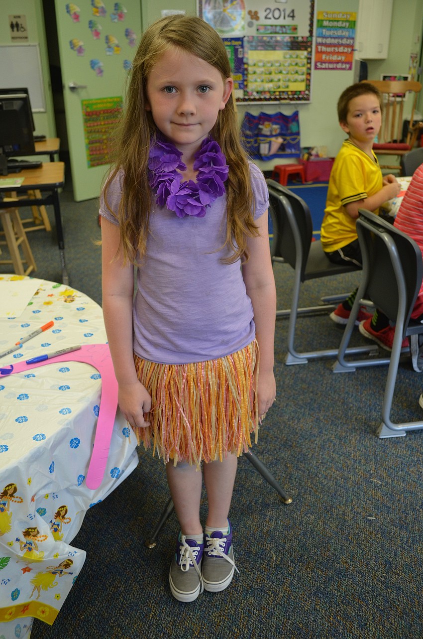 Ava Custer in her grass skirt.