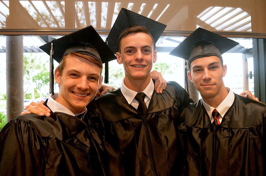 Dalton Wilkerson, Ethan Weaver and Cory Weaver wear matching outfits and smiles.