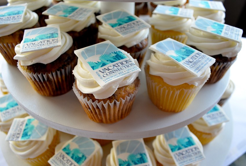 Cupcakes were decorated with the companyâ€™s logo at the party.