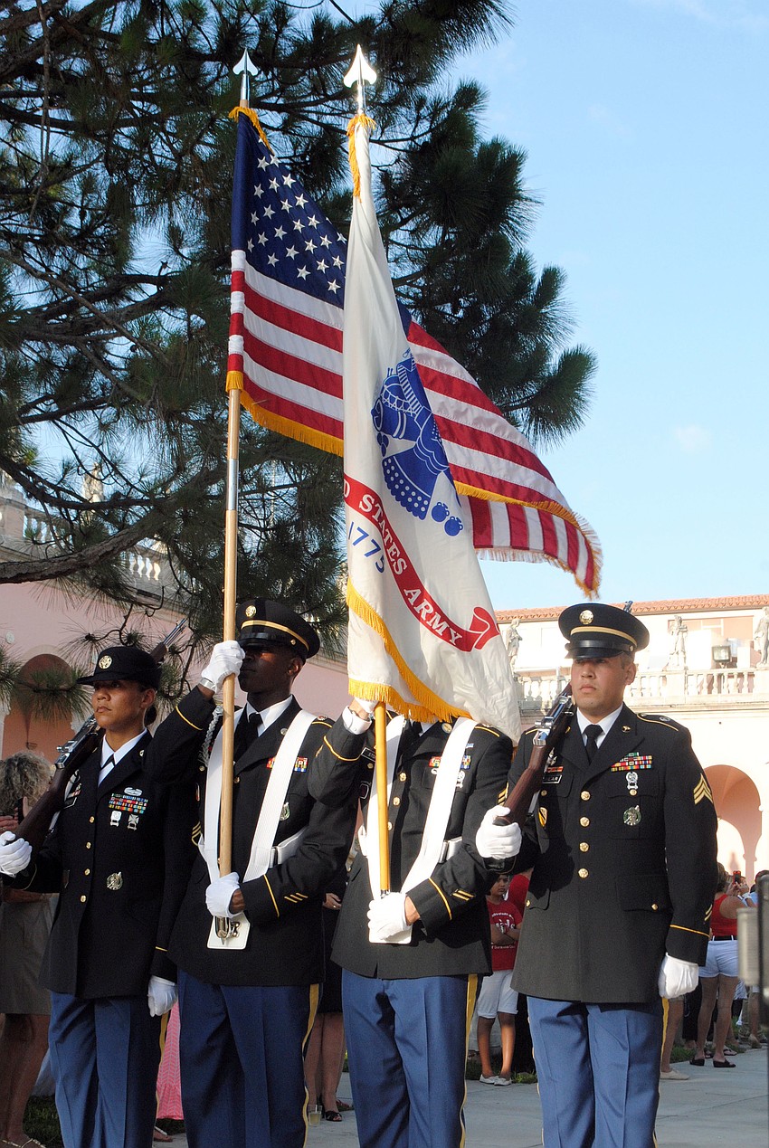 The Color Guard presents the flag.