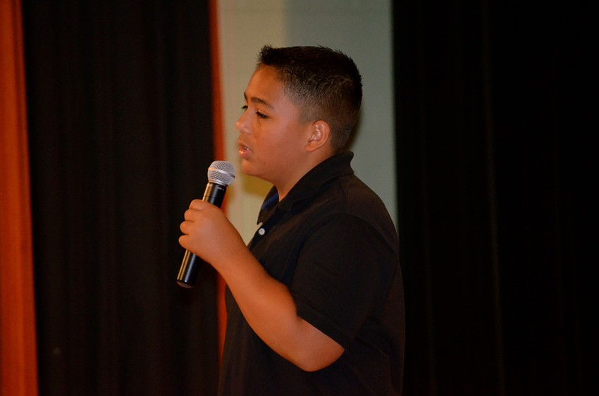 Marcus Gonzalez sings for the audience.