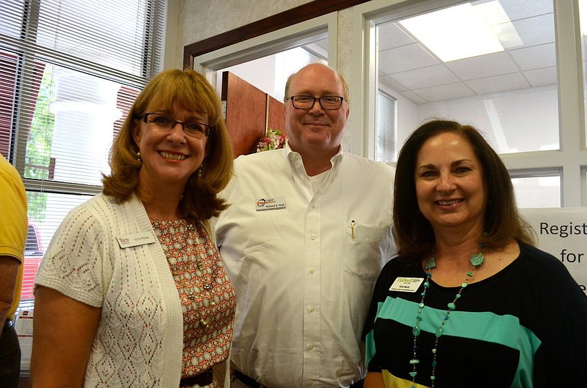 Sylvie Rhodes, Richard Geib and Vicki Bartz socialize.