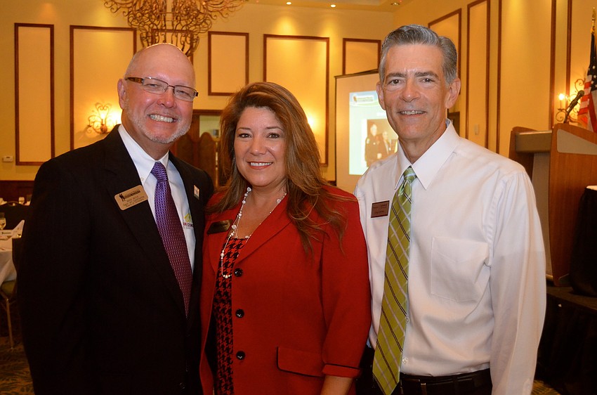 Mike Wick, Annette Gueli and Craig Cerreta wait for the officials' presentations to begin.